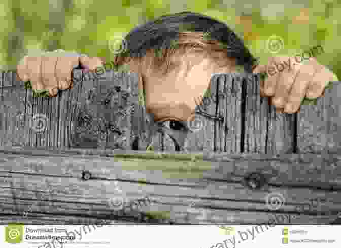 A Photo Of A Man In Torn Clothes, Cautiously Peering Over The Edge Of A Wooden Fence, Surrounded By Dense Vegetation. Escape From The Japanese: The Amazing Tale Of A PoWs Journey From Hong Kong To Freedom