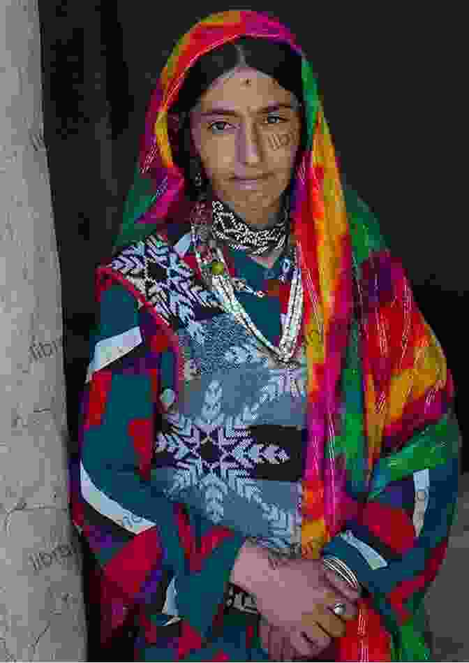 A Young Woman In Traditional Afghan Clothing Smiles And Looks Thoughtfully Off Into The Distance. An Undesirable Element: An Afghan Memoir (First Draft Publishing/Originals)