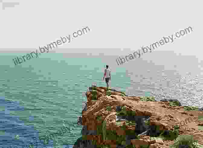 Image Of A Person Standing At The Edge Of A Cliff, Overlooking A Vast Ocean Supertanker Captain And Other Stories